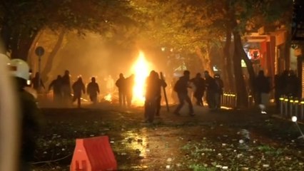 Protesters smash and burn shops during clashes with police