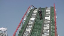 Trial biker driving on a rollercoaster! Crazy!