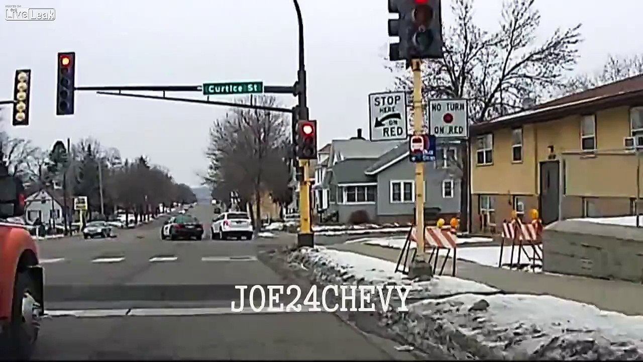 Police car running red light causes an accident