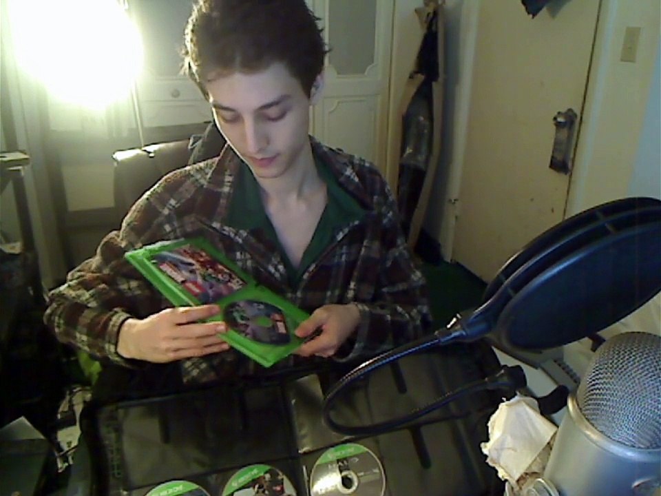 Xbox One Video Games Being Organized Into A DVD/CD Travel Case In Real Life