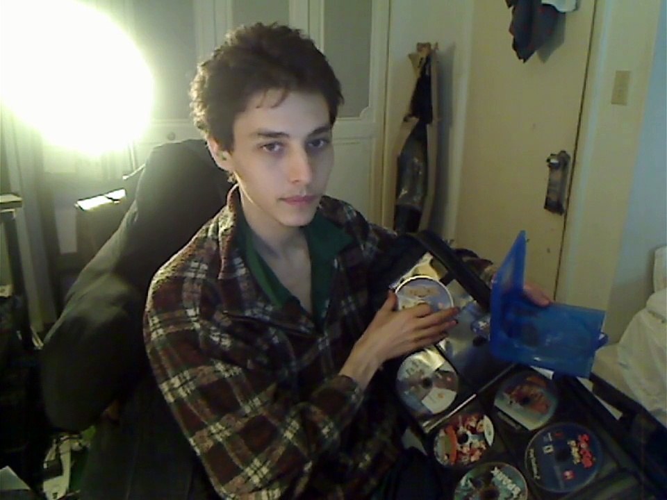 PlayStation 4 Video Games Being Organized Into A DVD/CD Travel Case In Real Life