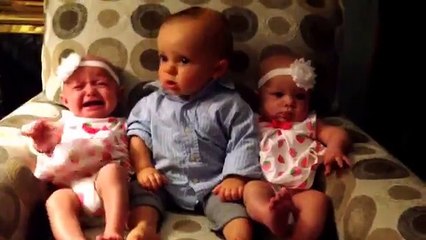 Funny baby re-action to see twins