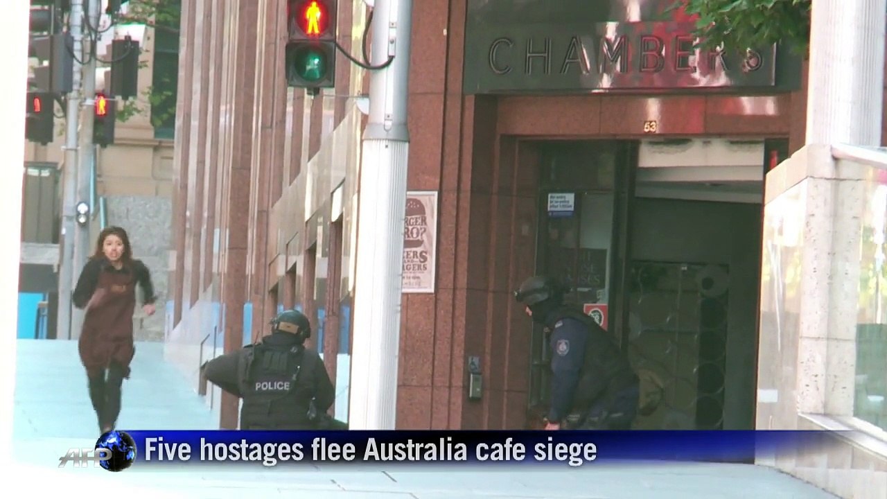 Five hostages flee Australia cafe siege