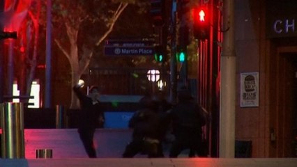 A group of hostages run from Sydney cafe hostage situation