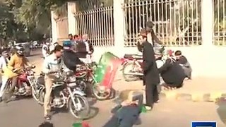 A citizen pass bike on the legs of a PTI worker who forcibly try to stop the road