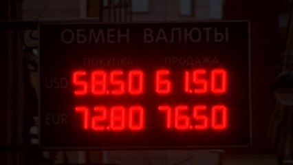 Russians unfazed as rouble hits historic lows