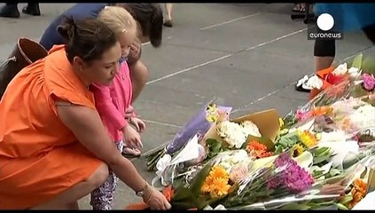 Flags fly at half-mast across Sydney after the violent end to a cafe siege