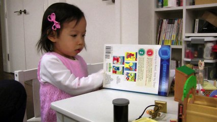 Girl Reading Sesame Street Book