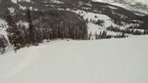 Skier falls off huge cliff