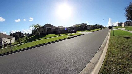 Kid falls off his skateboard and rolls downhill