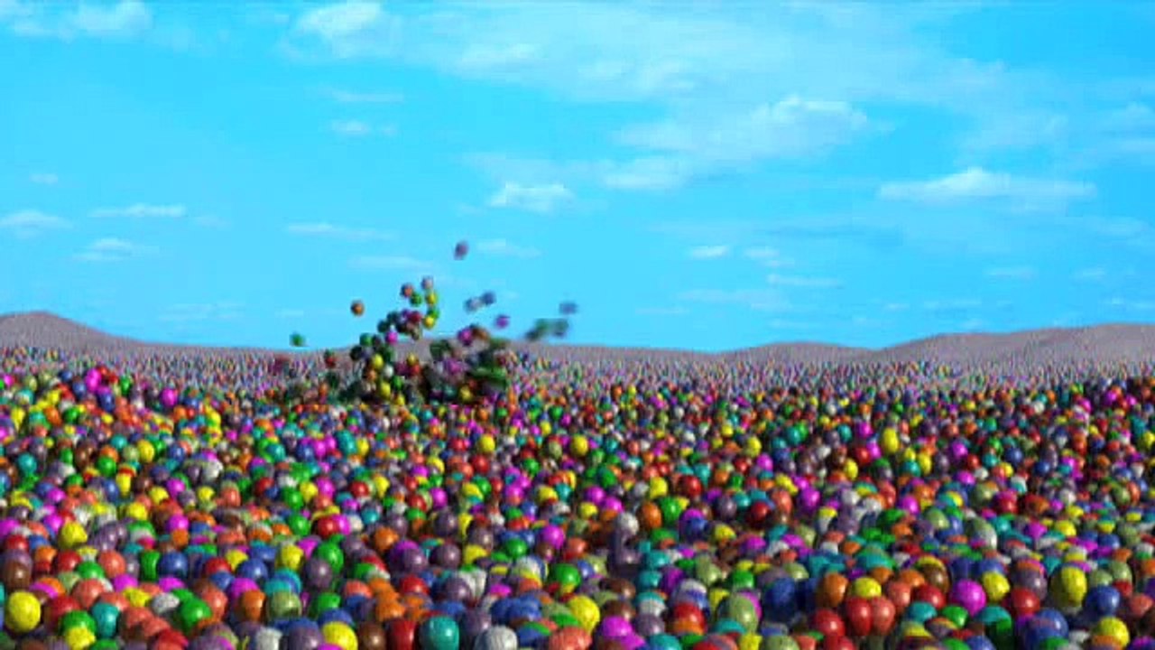 Bugsy the guinea-pig swimming in a sea of gumballs