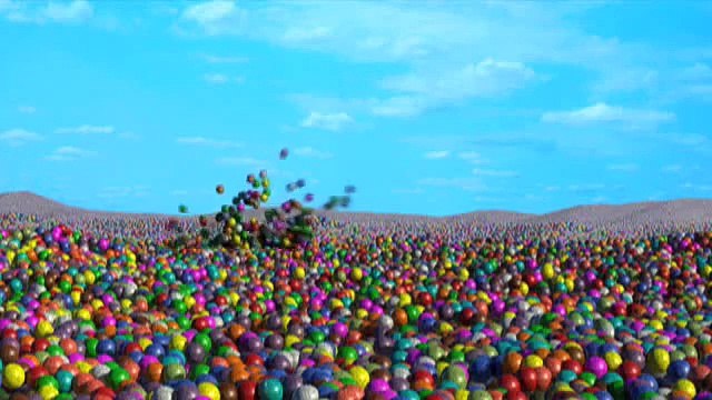 Bugsy the guinea-pig swimming in a sea of gumballs