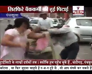 WIFE BEATING HIS HUSBAND ON A ROAD watch n share