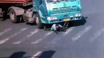 Cyclist almost killed by big truck! uckoest guy ever