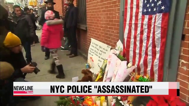 U.S. mourns shooting deaths of police officers