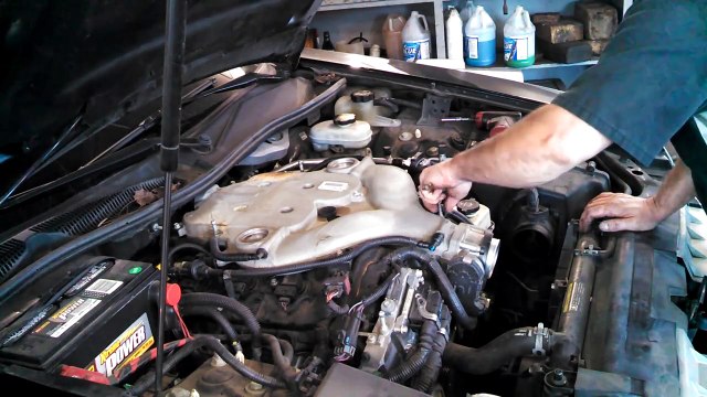 Spark plug replacement Cadillac CTS 3.6L 2007 ignition coil install remove replace how to change