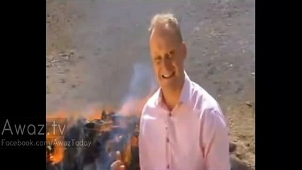 'Don't inhale!' BBC reporter gets so high standing next to stack of burning opium, heroin and hash, he can't finish his report