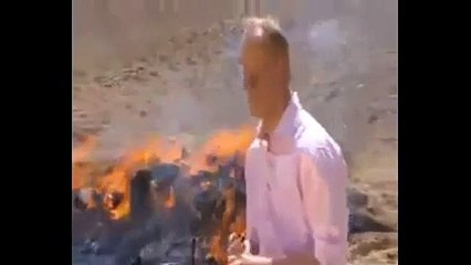Don't inhale!' BBC reporter gets so high standing next to stack of burning opium, heroin and hash, he can't finish his report