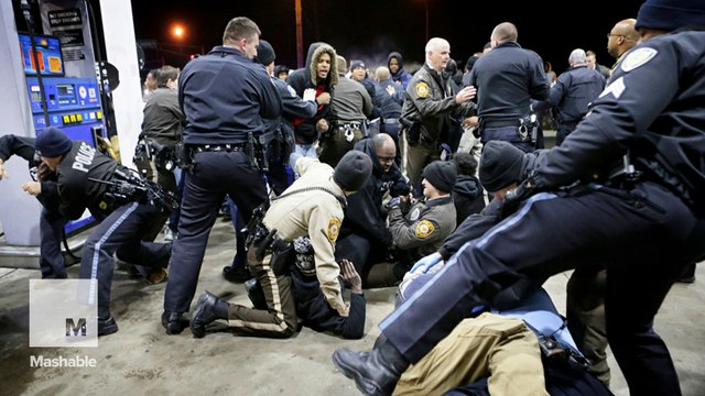 Police clash with protesters near Ferguson after black teen shot dead