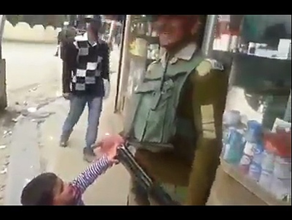 kid wants the gun of Pakistan army person.