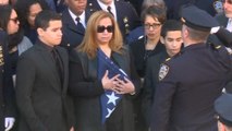 Widow of slain NYPD officer receives his burial flag