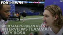 Ohio State's Doran Grant interviews teammate Joey Bosa