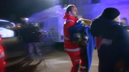 Migrants disembark abandoned cargo ship in Italian port