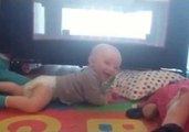 Baby Can't Stop Laughing at New Worm Toy