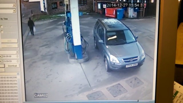 A Lady Cant Figure Out the Petrol Cap On her Car at a Petrol Station (HD)