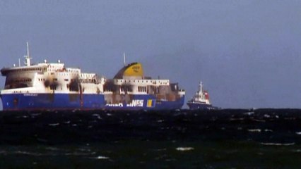 Wreckage of burnt ferry towed to Italian port