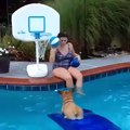 Girl Play Basket Ball With Dog In Swimming Pool