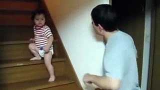 A Baby Kid Fight in his own way with his Father