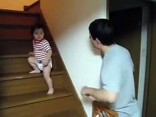 A Baby Kid Fight in his own way with his Father.