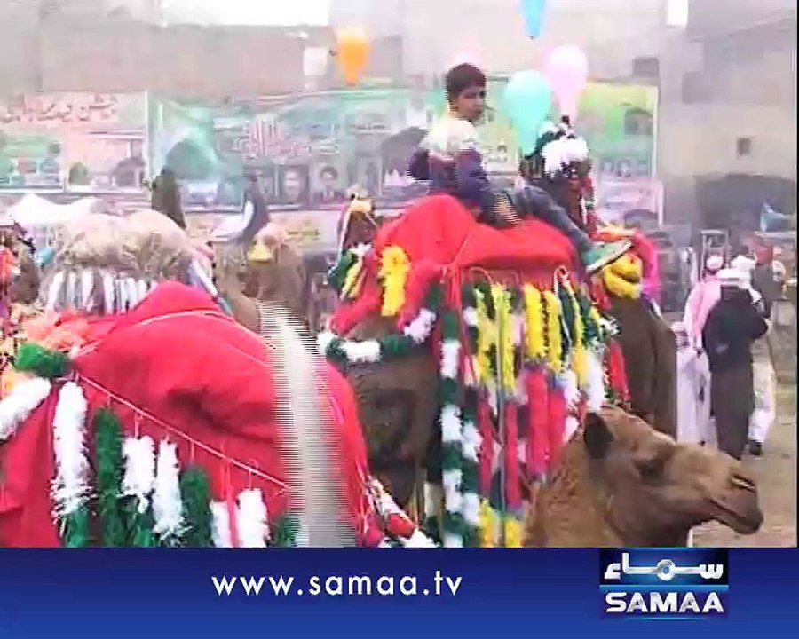 Political rivals together at Milad rally