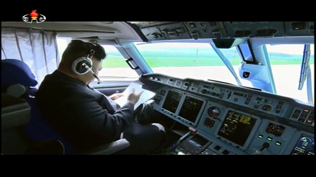 Kim Jong Un flying a plane