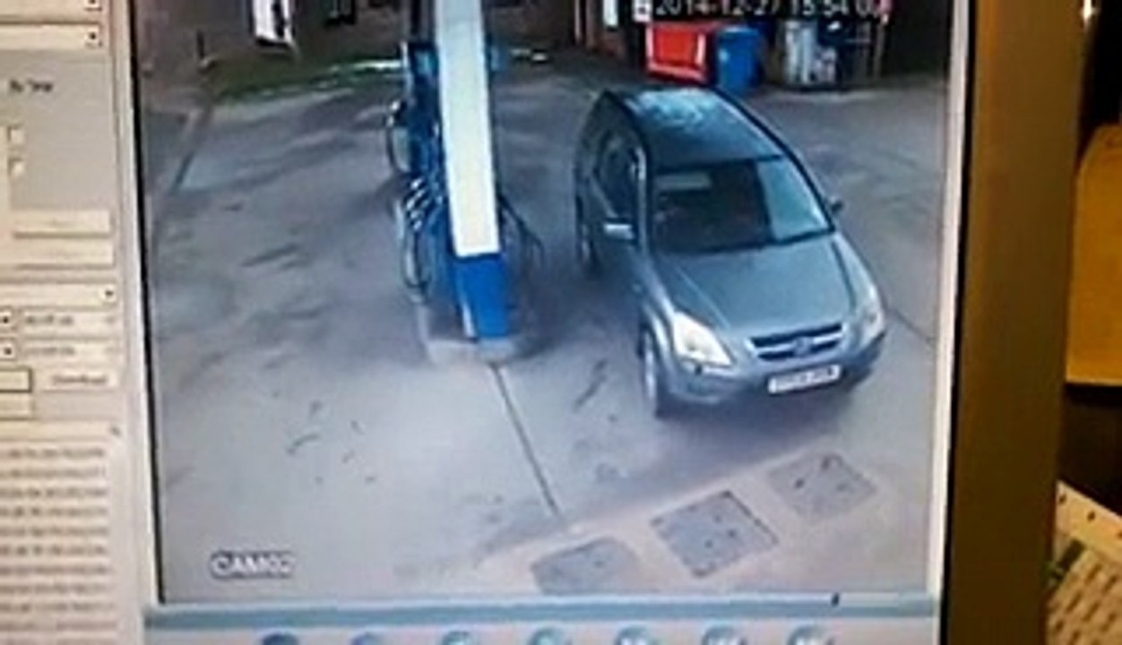 Woman drives round in circles in petrol pump fail.