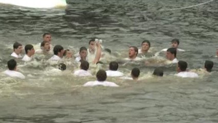 People Jump Into Cold Water To Celebrate Jesus's Baptism
