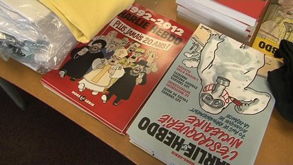 Fusillade à Charlie Hebdo: "j'ai vu deux personnes tirer sur un véhicule de police"