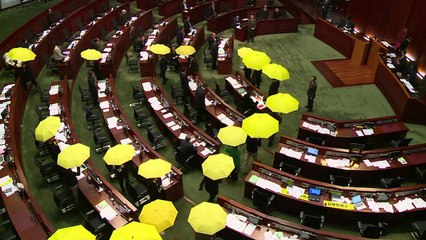 Small protests as Hong Kong takes next step on political reform