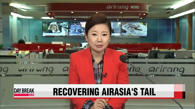 Recovery teams to try raising submerged AirAsia tail again Friday