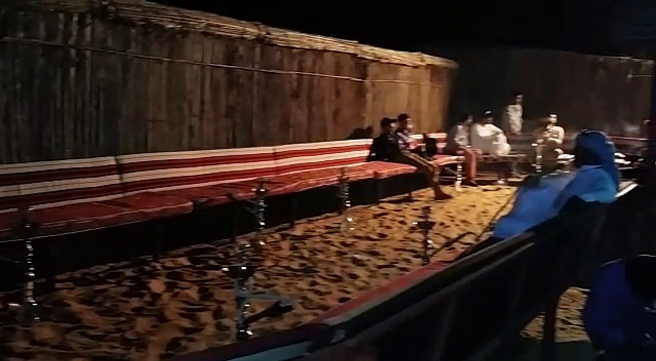 Smoking shisha in the Dubai desert, Overnight Desert Safari, Dubai Holidays With Best Value Tourism