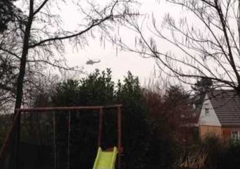 Helicopters Hover Over Dammartin-en-Goele Neighborhood