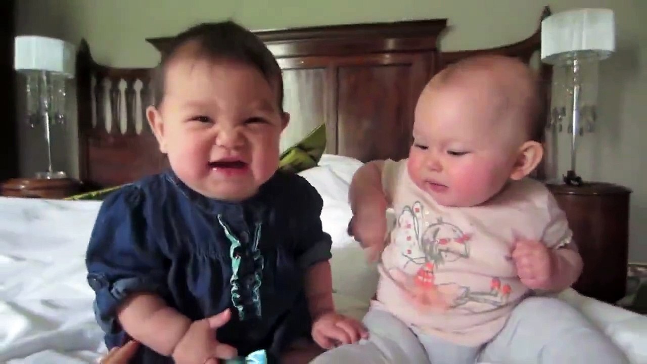 Two Really Cute Babies Playing.