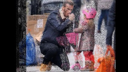 David Beckham looks on proudly as grinning Harper scoots through London