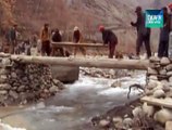 Angry residents start reconstruction of damaged bridge of hassanabad