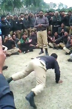 Pakistani police men dancing and enjoying