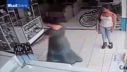CCTV captures woman stuffing a plasma TV
