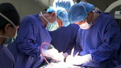 Doctors in China carry out world first spine surgery