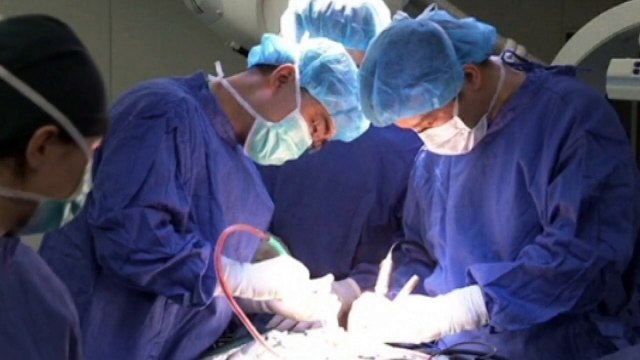 Doctors in China carry out world first spine surgery