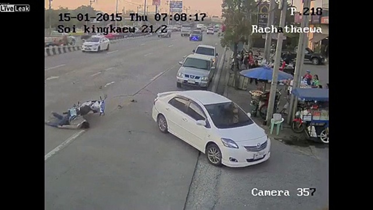 Biker not paying attention rear ends Car